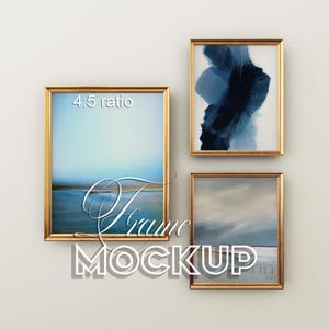 May include: Three framed art pieces with gold frames are displayed on a light gray wall. The art features abstract landscape paintings in shades of blue and gray. The text "4:5 ratio" and "Frame Mockup" are visible.