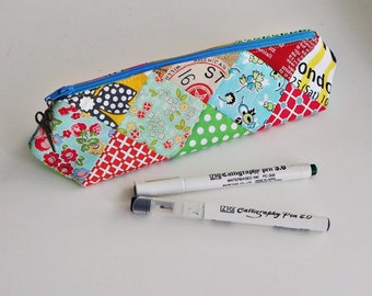 Pencil case pouch PDF sewing pattern, a fun & easy 3D elongated triangle prism shape zip patchwork bag design by Tikki London