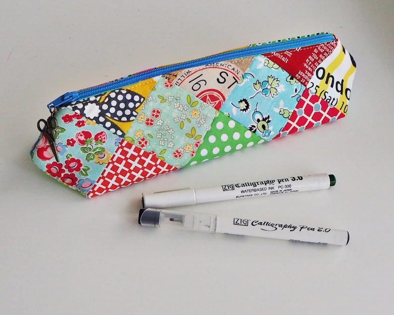 Pencil case pouch PDF sewing pattern, a fun & easy 3D elongated triangle prism shape zip patchwork bag design by Tikki London