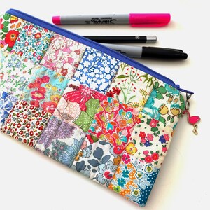 Easy Patchwork Pencil Case PDF Sewing Pattern, sample pouch made in pretty Liberty London ditsy floral fabrics, quilted zip bag tutorial.