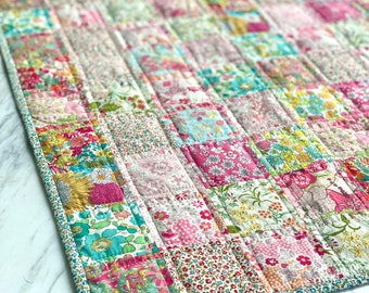 Baby Quilt PDF Pattern easy small crib size beginner patchwork design made up in Liberty ditsy floral fabrics, make your own baby heirloom