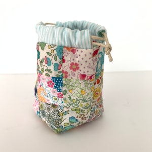 Drawstring Patchwork Bag Pattern, easy sewing tutorial for small modern pouch design, beginner friendly PDF instructions download by Tikki