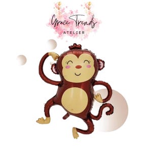 May include: A maroon monkey-shaped balloon with a light brown belly and limbs. The balloon has a smiling face with closed eyes and a small red nose. The balloon is part of a party decoration theme.