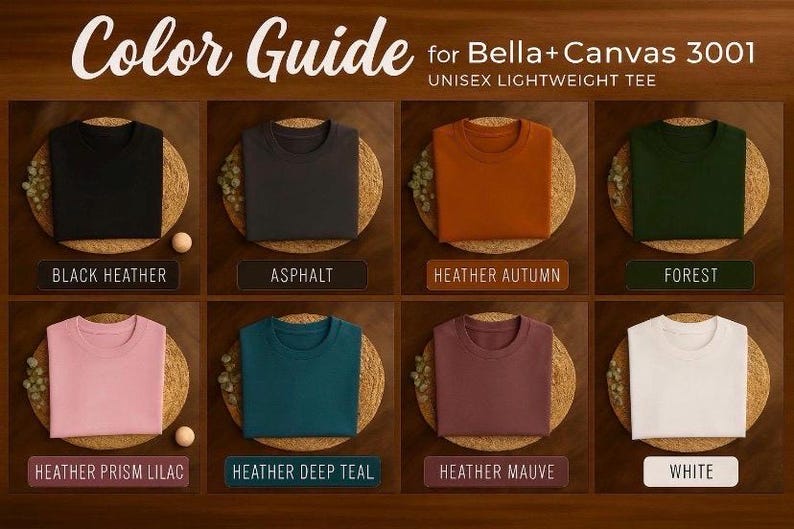 May include: A color guide for Bella+Canvas 3001 unisex lightweight tee featuring eight folded t-shirts in black heather, asphalt, heather autumn, forest, heather prism lilac, heather deep teal, heather mauve, and white, each labeled with its color name.