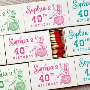 May include: White matchboxes with a retro illustration of a woman on a disco ball, with the text "Sophia's 40th Birthday" in pink and green. One box is open, revealing red-tipped matches.