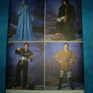May include: A sewing pattern featuring four different costume designs. The first design is a long, light blue robe. The second design is a long, dark brown robe with a hood. The third design is a black, long-sleeved shirt with a belt. The fourth design is a brown, long-sleeved shirt with a belt.