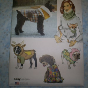 May include: A sewing pattern for dog clothes. The pattern includes five different designs: a plaid coat, a reindeer costume, a plaid vest, a floral dress, and a hooded vest. The pattern is called "easy-to-sew" and is designed and printed in the USA.