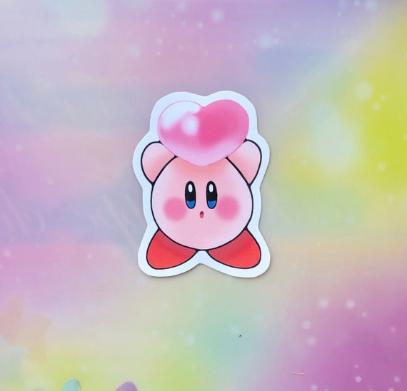 kirby holding heart plush