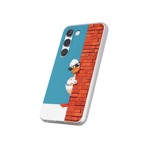 May include: A phone case featuring a cartoon duck wearing sunglasses, peeking from behind a brick wall. The case has a blue background and a white border. The duck has white feathers and an orange beak.