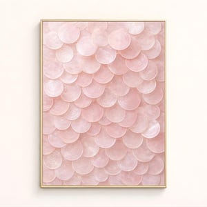 May include: A framed artwork featuring a pattern of overlapping, light pink, circular shapes. The circles create a textured, scale-like appearance. The frame is a light, natural wood color.
