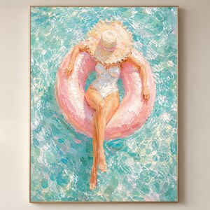 May include: Oil painting of a person in a white swimsuit and straw hat floating on a pink inflatable ring in a pool. The water is a mix of turquoise and blue, with brushstrokes creating a textured effect. The artwork is framed.