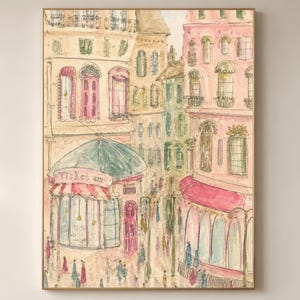 Parisian street scene watercolor wall art print with pink doors, teal awnings, and soft figures strolling below European architecture