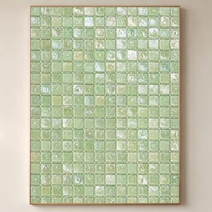 May include: A framed artwork featuring a grid pattern of small, square, light green glass blocks. The blocks have a slightly textured appearance and are arranged in a repeating pattern. The frame is a light brown color.