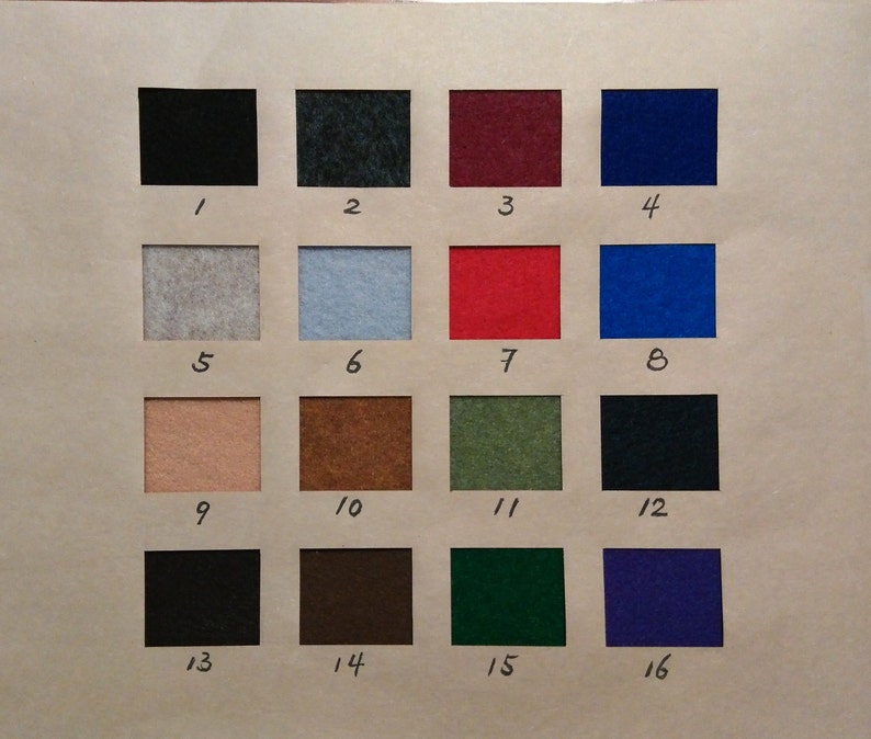 May include: A color chart featuring sixteen squares of felt in various colors, each labeled with a number from 1 to 16. The colors include black, blue, red, green, and neutral tones like beige and gray. The chart is on a light brown background.