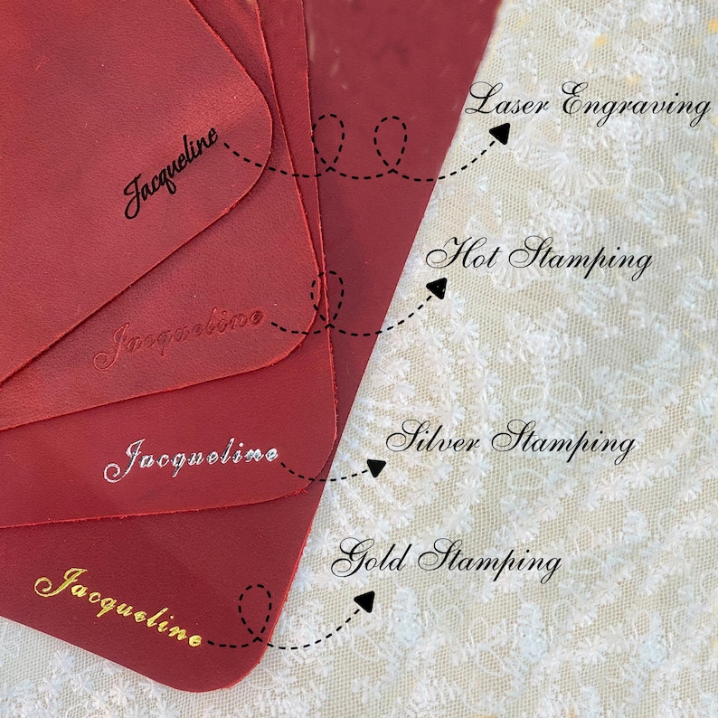 May include: A close-up of red leather samples with the name "Jacqueline" displayed using different techniques: laser engraving, hot stamping, silver stamping, and gold stamping. The samples are arranged to showcase the various methods.