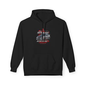 May include: A black hooded sweatshirt featuring a graphic print of a silver Mitsubishi Lancer Evolution IX car. The design includes red accents, the Mitsubishi logo, and text that reads MITSUBISHI, EVOLUTION IX, and SPEED CULTURE.