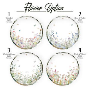 May include: Four clear, faceted glass ornaments with floral designs and butterflies. Each ornament features a different wildflower arrangement: colorful, blue and violet, white and green, and pink and yellow. The text "Flower Option" is above the ornaments.