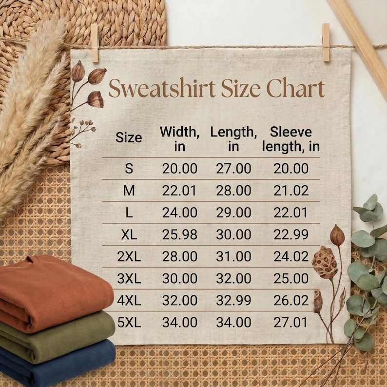 May include: Folded sweatshirts in rust, olive green, and navy blue are stacked below a pinned size chart. The chart details sizes S to 5XL, with measurements in inches for width, length, and sleeve length.