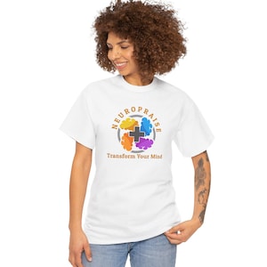 May include: White t-shirt with a colorful circular graphic featuring the word "NEUROPRAISE" and the phrase "Transform Your Mind." The graphic includes a cross and four brain-like shapes in yellow, orange, purple, and blue.