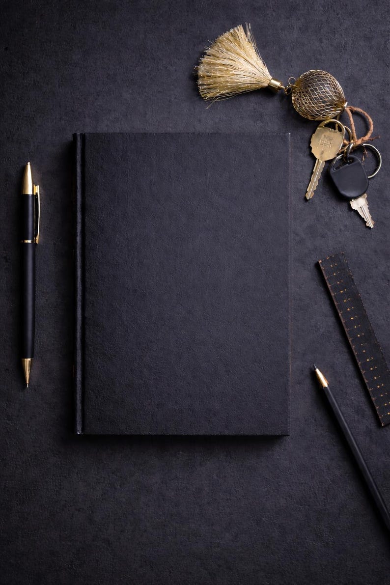 Minimalist black paper journal made for creative writing, sketching, and artistic notes using markers. The hardcover keeps the design clean and professional. Thick black pages prevent bleed-through, while a bright pink accent at the end adds a modern luxury touch.