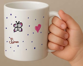 Personalized ceramic mug with a child's drawing printed using sublimation.