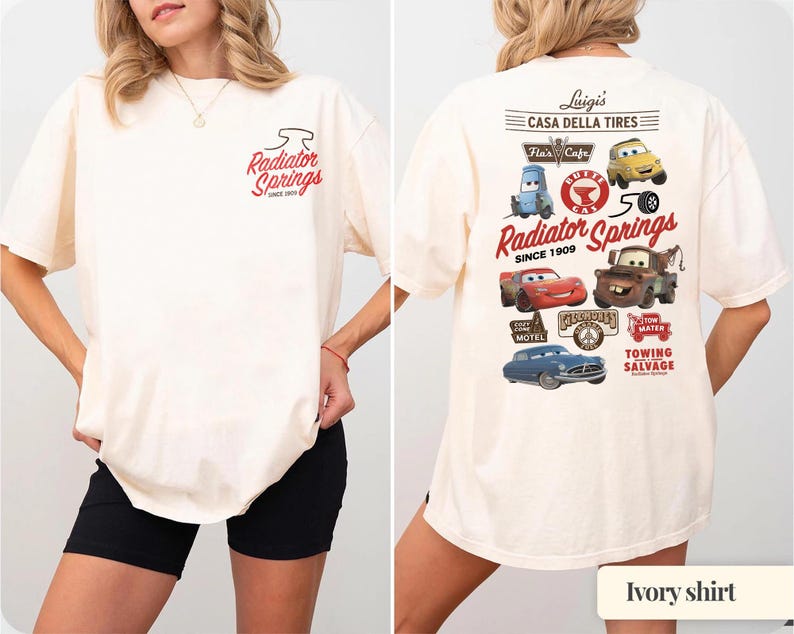 May include: An ivory t-shirt featuring a small Radiator Springs logo on the front left chest. The back displays a large graphic with various Cars characters, including Lightning McQueen and Mater, alongside text reading Luigi's Casa Della Tires.
