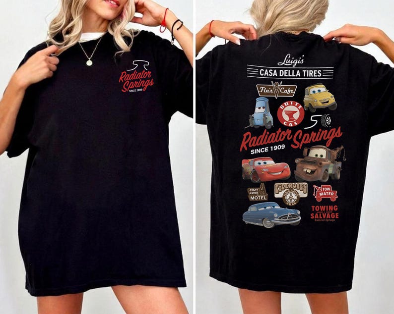 May include: A black t-shirt featuring a small Radiator Springs logo on the front chest. The back displays a large graphic with various characters and logos, including Luigi's Casa Della Tires, Flo's Cafe, and the text Radiator Springs Since 1909.