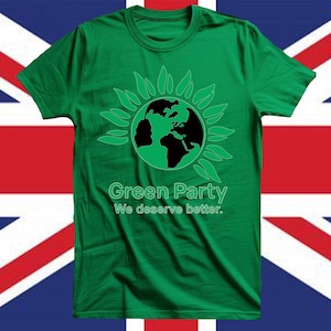 May include: Green t-shirt featuring a green and black graphic of the Earth encircled by leaves. The text "Green Party" and "We deserve better" are printed below. The shirt is set against a backdrop of the Union Jack flag.