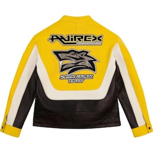 May include: Yellow, black, and white leather jacket with the text "AVIREX RACING" and "SUPER RACER TEAM". The jacket features a wolf graphic on the back. The jacket has a classic motorcycle jacket design with a snap collar and buttoned cuffs.