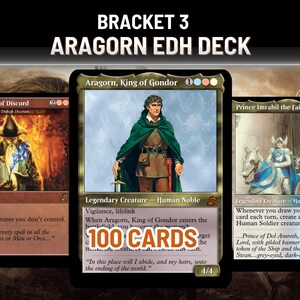 May include: Three Magic: The Gathering cards are displayed, featuring fantasy art and text. The central card showcases Aragorn, King of Gondor, with the text "100 CARDS." The other cards feature "Spells Born of Discord" and "Prince Imrahil the fair."