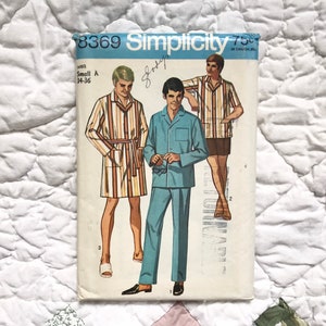 May include: Vintage Simplicity sewing pattern number 8369 for men's pajamas. The pattern includes three different styles: a striped robe, a solid blue pajama top and pants, and a striped short-sleeved shirt with matching shorts.
