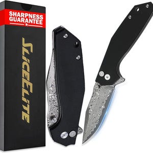 May include: A black folding knife with a patterned blade is displayed open and closed. The knife has a black handle and a silver blade with a unique design. The box on the left has the words "SHARPNESS GUARANTEE" and "SLICELITE" in gold.