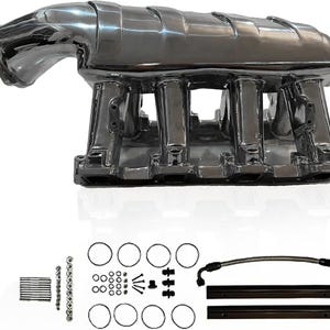 May include: A polished chrome engine intake manifold featuring a multi-runner design. Included are various small metal components, including bolts, washers, circular gaskets, three black plastic fittings, two black fuel rails, and a braided fuel line.