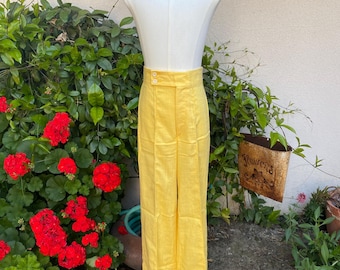 Pantalones acampanados amarillos de los años 70, de cintura alta, con pliegues y sin bolsillos, de H.I.S. para cintura 25.