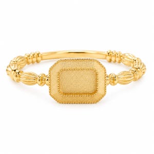May include: A gold ring featuring a central rectangular plaque with a textured matte finish, bordered by a beaded edge. The band consists of a series of repeating, vertically ribbed, oval-shaped segments that connect to the central rectangular piece.