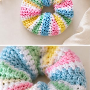 Peut inclure: Un chouchou pour cheveux fait à la main, en crochet. Il présente un motif rayé aux couleurs pastel : rose, jaune, bleu, vert et blanc. Sa forme circulaire est idéale pour attacher les cheveux en queue de cheval ou en chignon.