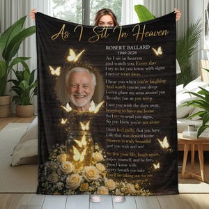 May include: Black blanket with the text "As I Sit In Heaven" and a photo of a man. The blanket features butterflies, roses, and a poem. The man's name and dates are also included.