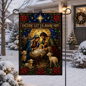 May include: A rectangular garden flag featuring a stained-glass style nativity scene with Mary, Joseph, and the infant Jesus in a manger. The text O COME LET US ADORE HIM is printed at the top. The scene includes three lambs and poinsettia borders.