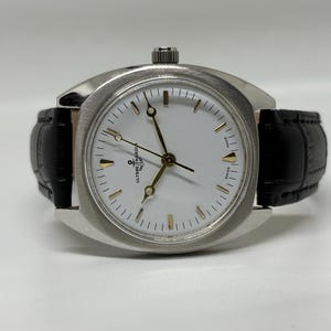Vintage Ulysse Nardin 17 Jewels Handaufzug Swiss Made Herrenarmbanduhr mit weißem Zifferblatt Bild 6