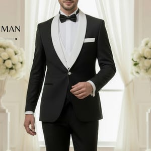 Traje de caballero de tres piezas en blanco y negro: esmoquin blanco con solapa de chal y pajarita negra para ocasiones formales. Elegante traje formal para caballero.