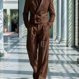 May include: A brown double-breasted suit jacket with matching wide-leg trousers. The jacket features a peaked lapel and four buttons. The trousers have a pleated front and a small LF logo on the left leg. The text LUXE FORMAL RETRO APPARELS is visible.