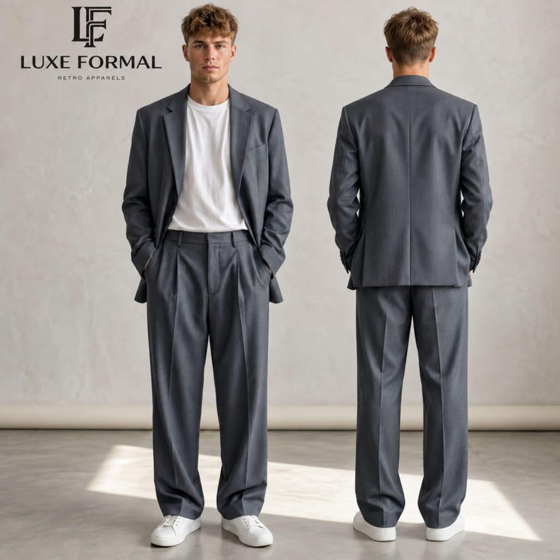May include: A grey suit consisting of a single-breasted blazer with notched lapels and matching pleated trousers, worn over a plain white t-shirt with white sneakers. The Luxe Formal Retro Apparels logo is visible in the top left corner.