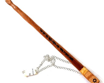 May include: A wooden pointer with a silver chain and a Star of David at the end. The pointer is inscribed with Hebrew text.