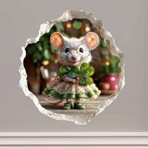 May include: A whimsical illustration of a mouse wearing glasses and a green dress, holding a four-leaf clover. The mouse is set against a blurred background, framed by a torn-paper effect, creating a charming, storybook aesthetic.