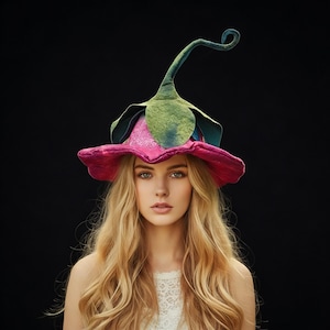 May include: A distinctive flower-shaped hat featuring a bright pink petal brim, green leaf details, and a curled stem. The hat is set against a black backdrop, creating a strong contrast. A unique accessory.