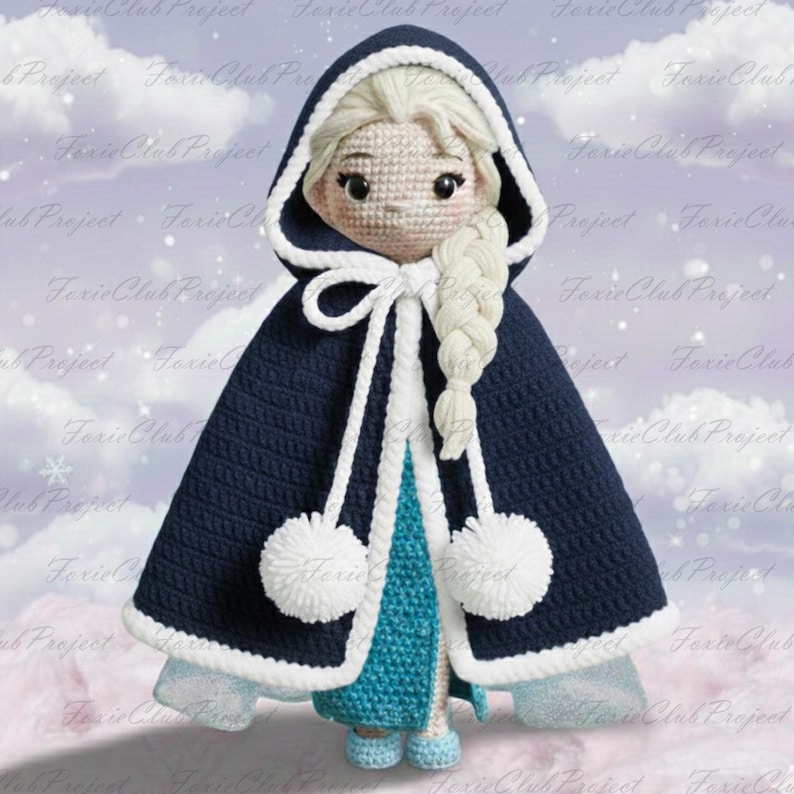 May include: A handmade crochet doll of a character wearing a navy blue hooded cape with white trim and pom-poms. The doll has a blonde braid and is wearing a blue dress and shoes. The background has a snowy effect.