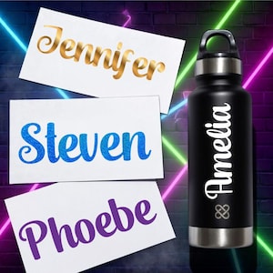 May include: A black water bottle with the name "Amelia" in white script. Three white cards display names: "Jennifer" in gold, "Steven" in blue glitter, and "Phoebe" in purple script. The background has neon lights.