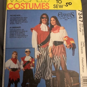 May include: A sewing pattern for pirate costumes. The pattern includes instructions for making costumes for both adults and children. The pattern is for sizes 42-44, extra large. The pattern is called "Charades" and is from McCall's.