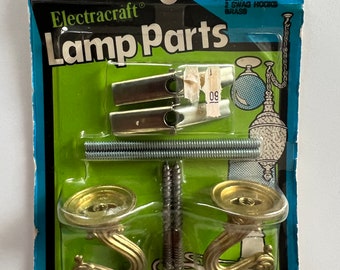 May include: Package of two brass swag hooks with screws and wire connectors. The package is labeled "Electracraft Lamp Parts" and "56-250 2 Swag Hooks Brass".