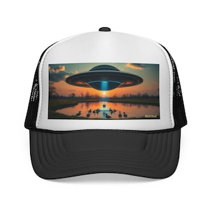 Duck Abduction Scene #2. This hat captures a quiet moment of wonder as something otherworldly touches down on the ducks at sunset.